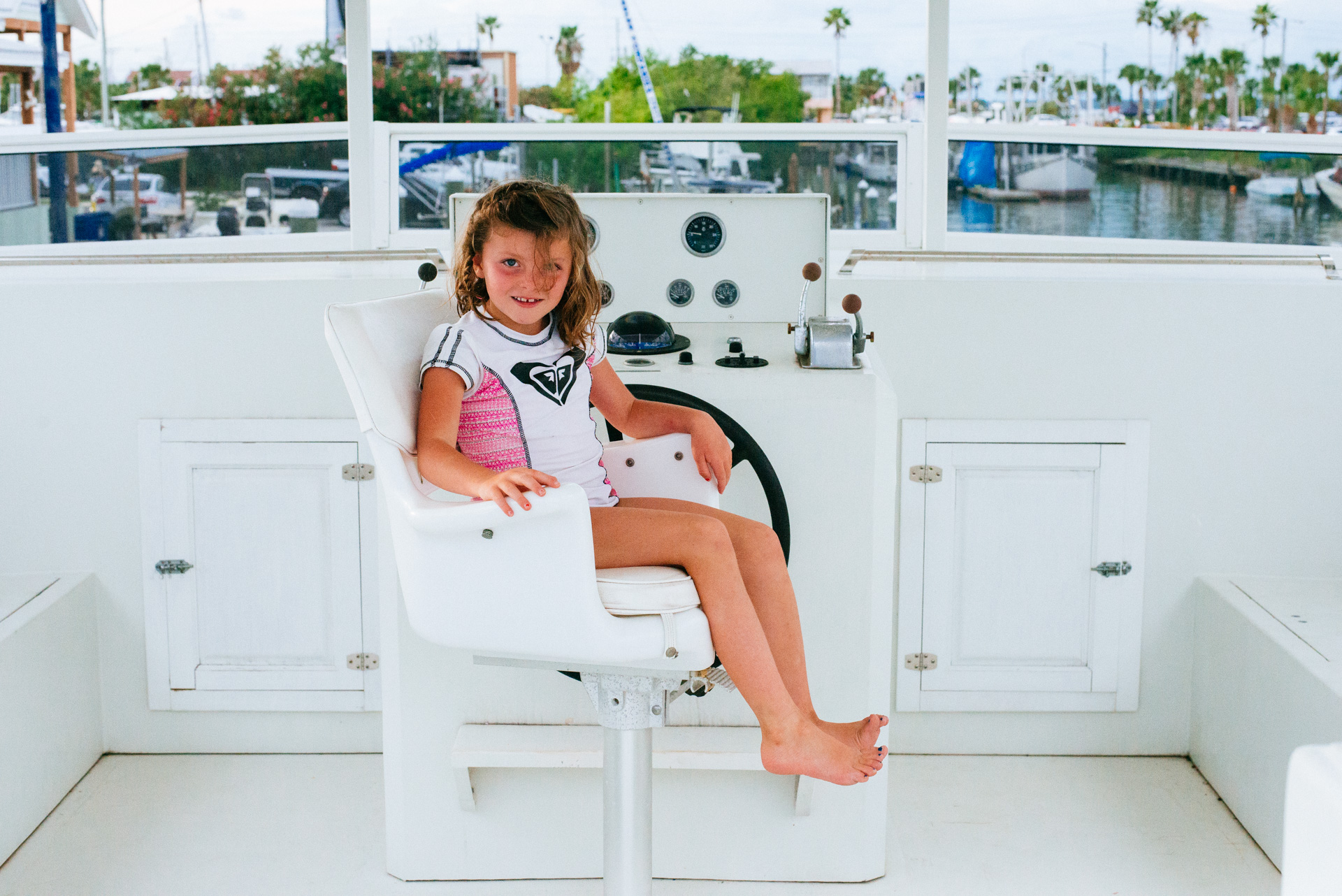 girl in captains chair, moss image, chris moss, moab photographer, cuba, florida