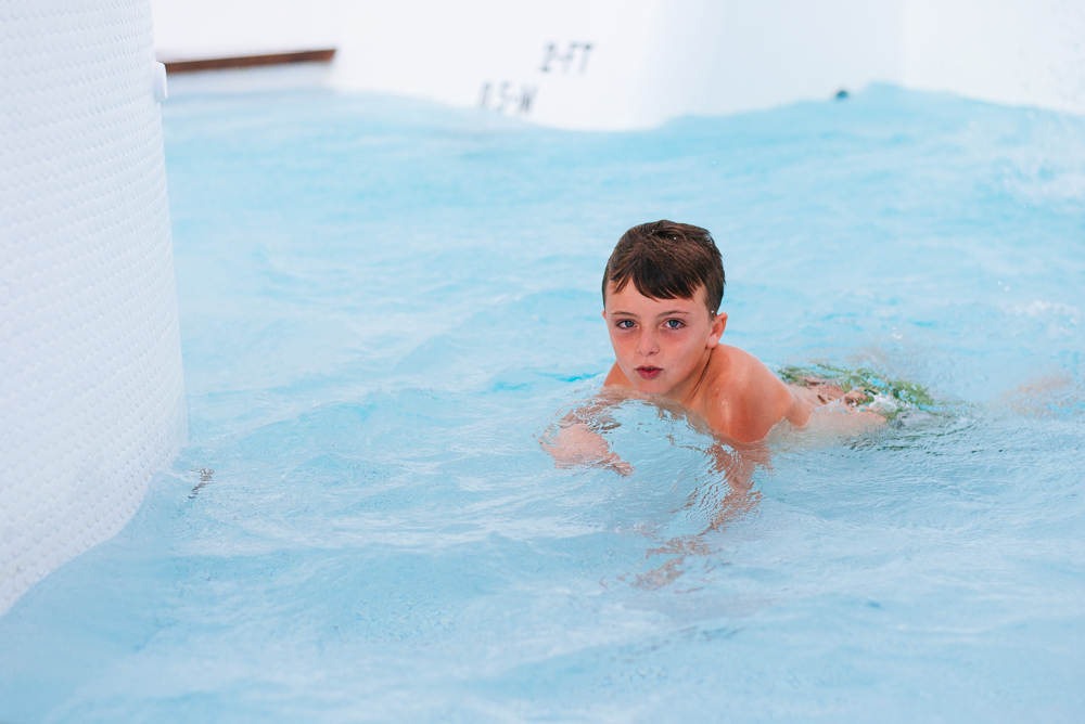 moss image, kid swimming in pool