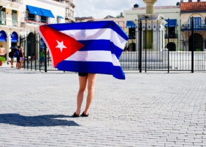 cuban flag held by girl, moss image, moab photographer, chris moss