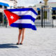 cuban flag held by girl, moss image, moab photographer, chris moss