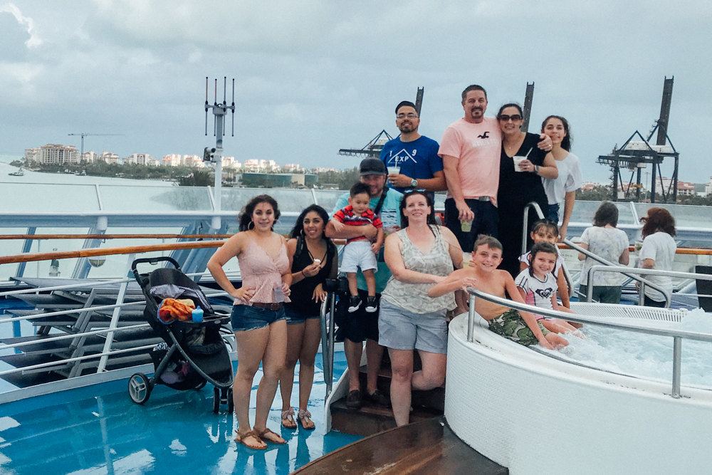 family standing on ship, cuba, travel